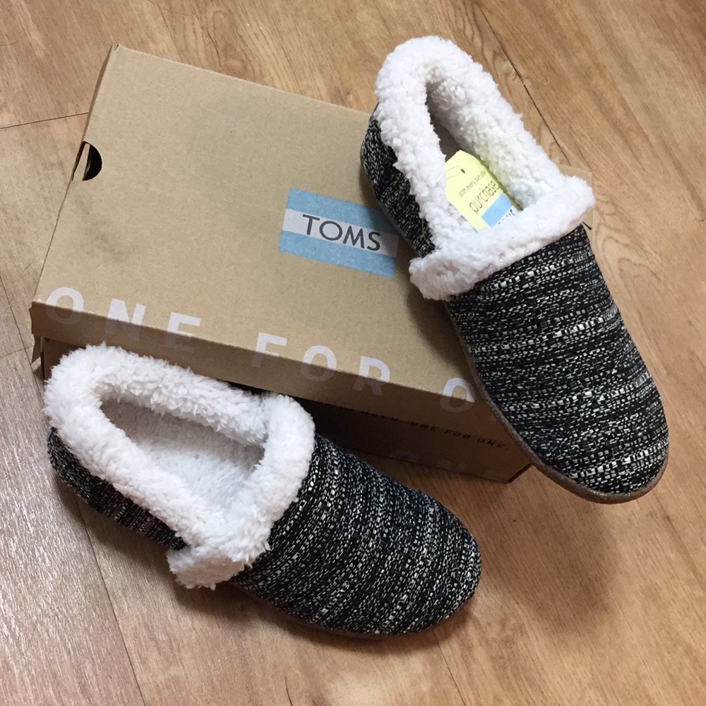 Never worn size 5 Toms slippers in the box!